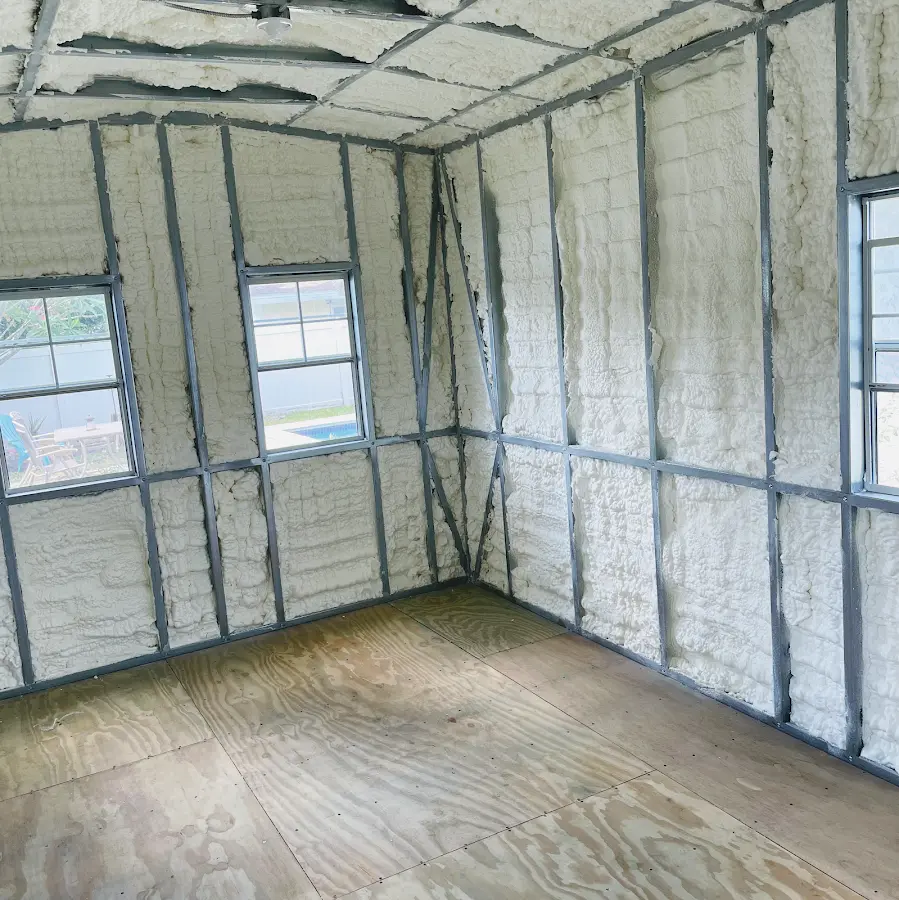 Closed-cell spray foam insulation applied to wall cavities in a residential project in Madison